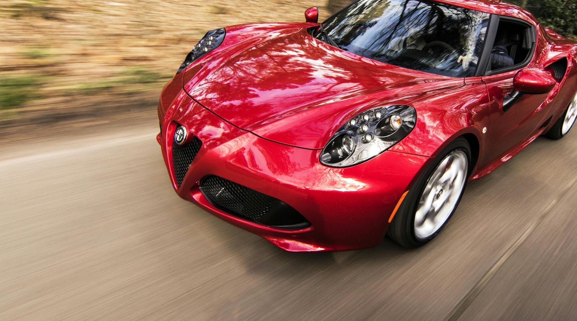 Red Alfa Romeo C4 on Road Near Trees